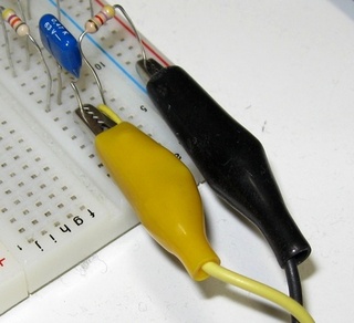 Crocodile clips connected to the breadboard